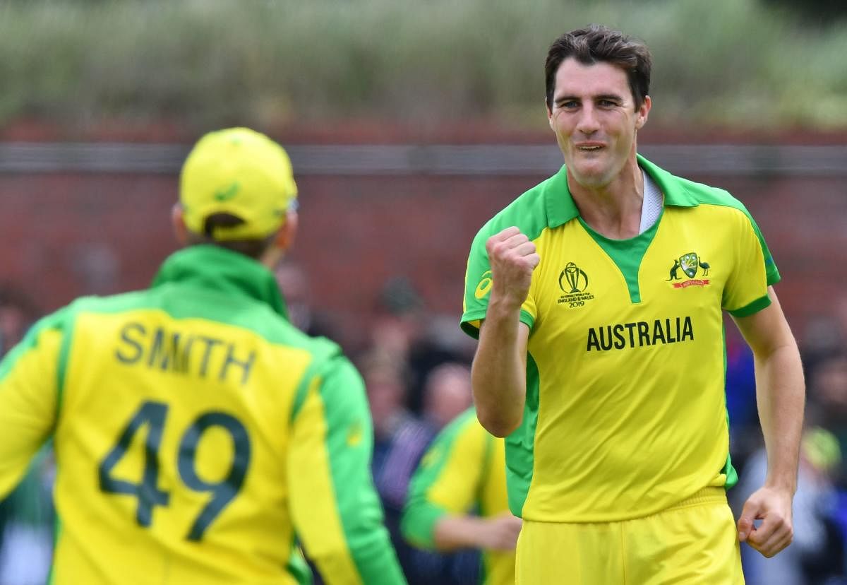 Australia's Pat Cummins (R) celebrates taking a wicket during the 2019 Cricket World Cup. Credit: Saeed Khan/AFP