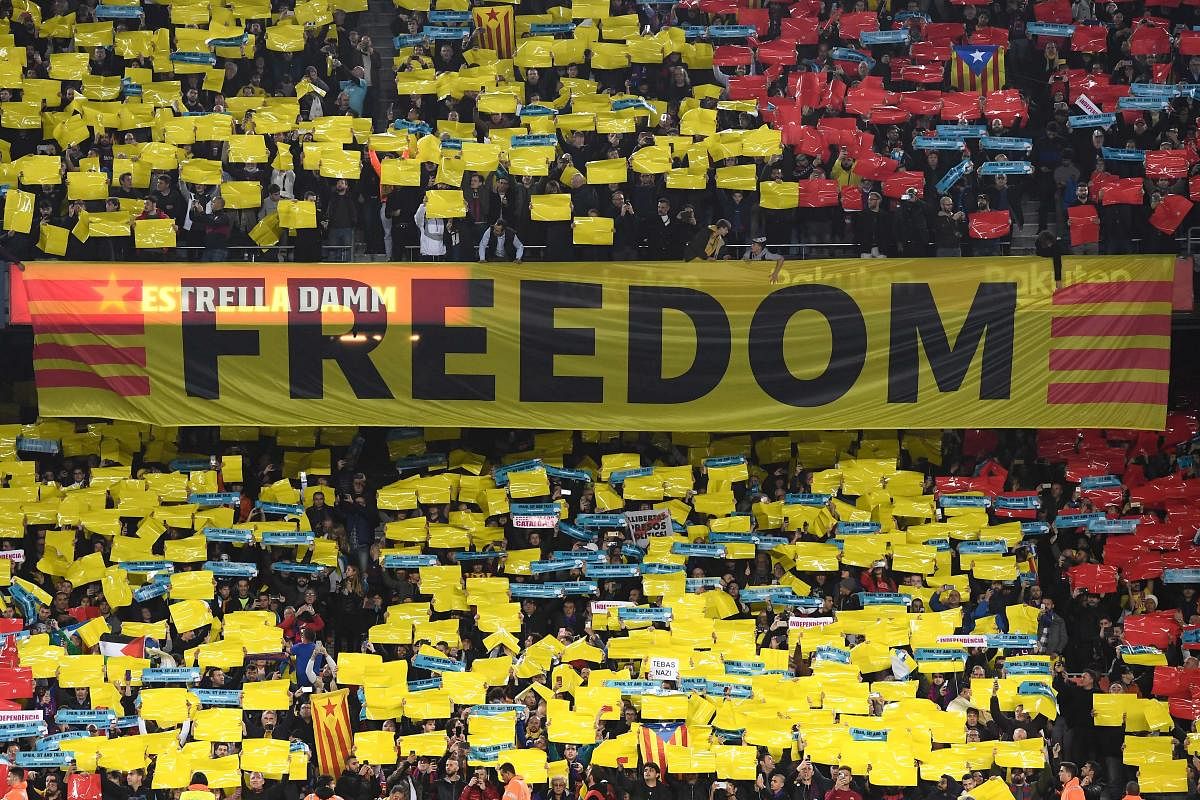 Barcelona supporters wave a banner reading Freedom during the El Clasico on Wednesday. AFP