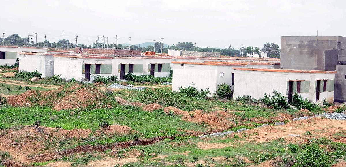Houses built under Ashraya housing scheme. The Gram Panchayat Hakkottaaya Andolana has opposed govt's decision saying the proposed monitoring committees would undermine the right and power of GPs as local self-government. DH FILE PHOTO