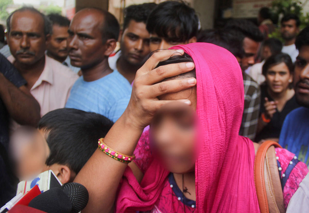 A relative of the Unnao rape survivor talks to the media outside KGMC Hospital where she is being treated, in Lucknow, Monday, July 29, 2019. The rape survivor got injured in a road accident near Raebareli, Sunday. (PTI Photo)