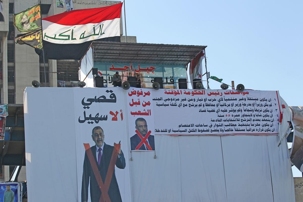 Amid ongoing anti-government protests in Tahrir square of Baghdad, protestors display the faces of the rejected candidates crossed out in red on the posters.