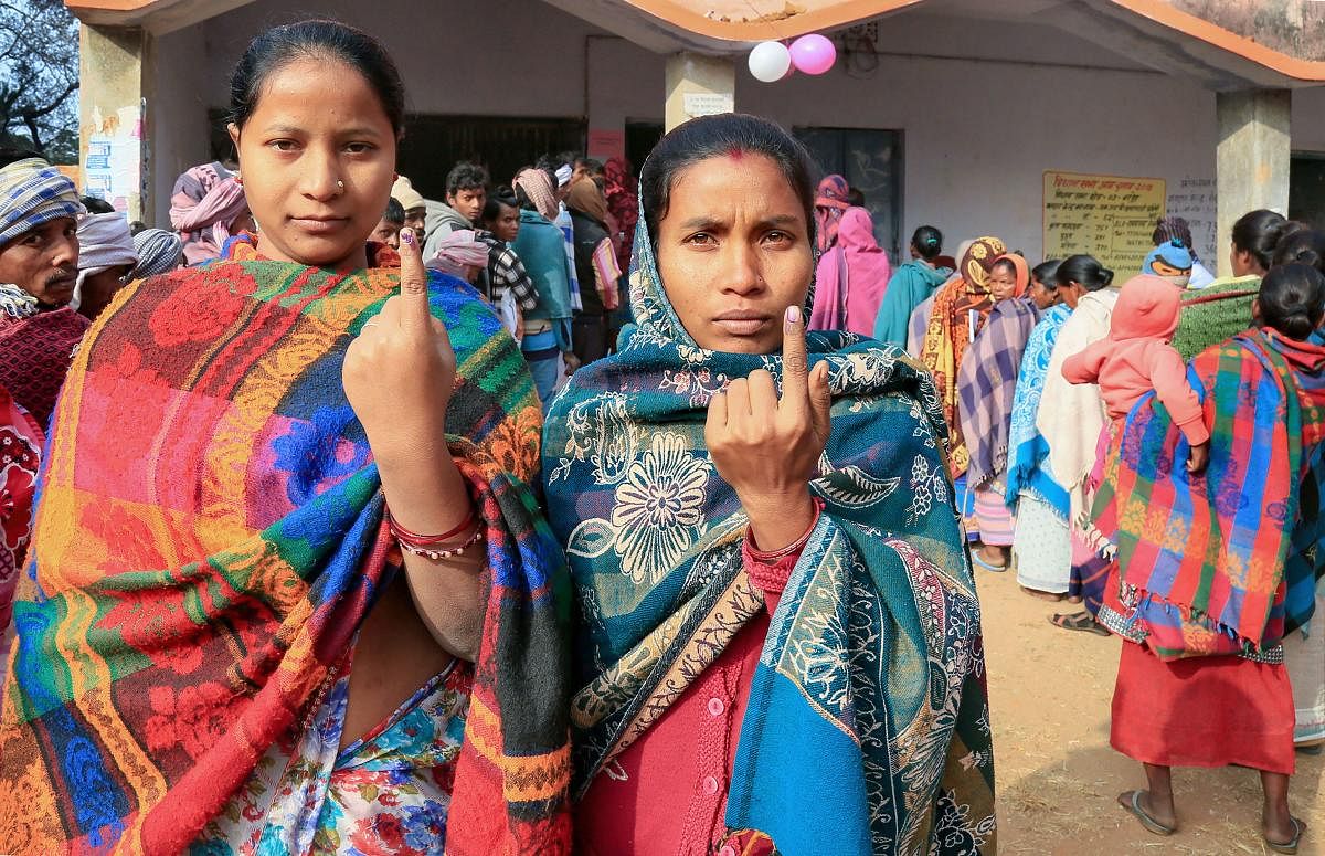 oters display their fingers marked with indelible ink after casting their votes during the fifth phase of the Jharkhand Assembly elections, in Godda district. PTI