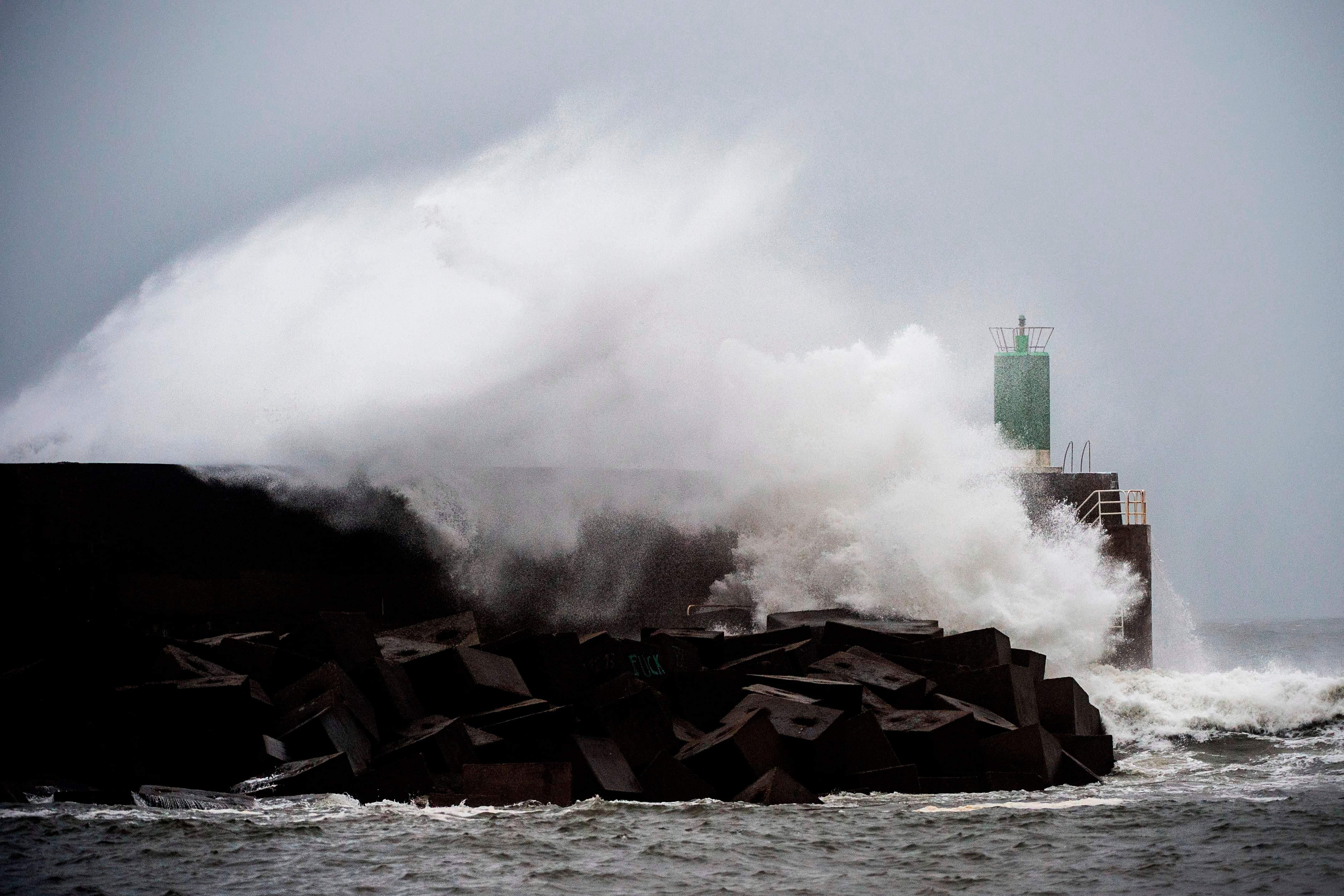Waves hit the jetty of the port of A Guarda, northwestern Spain, during the storm Fabien. (AFP Photo)