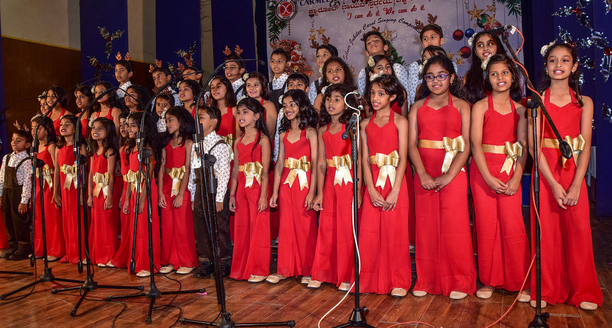 Children take part in carol-singing competition in Mysuru. DH photos
