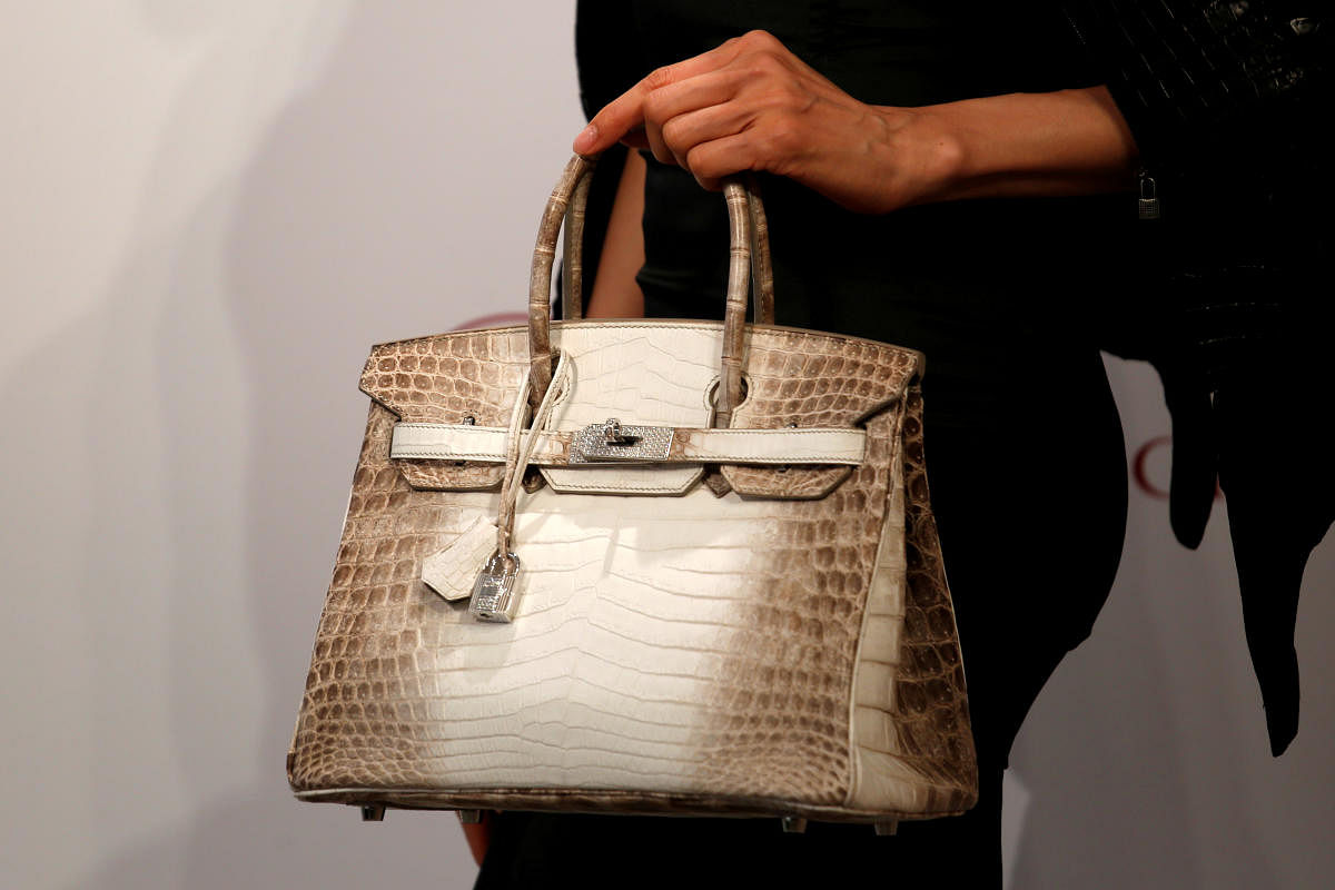 A model carries a Hermes signature Birkin with Himalayan crocodile leather and diamonds, sold for $300,168 at a Christie's auction on May 30, 2016. (Reuters Photo)
