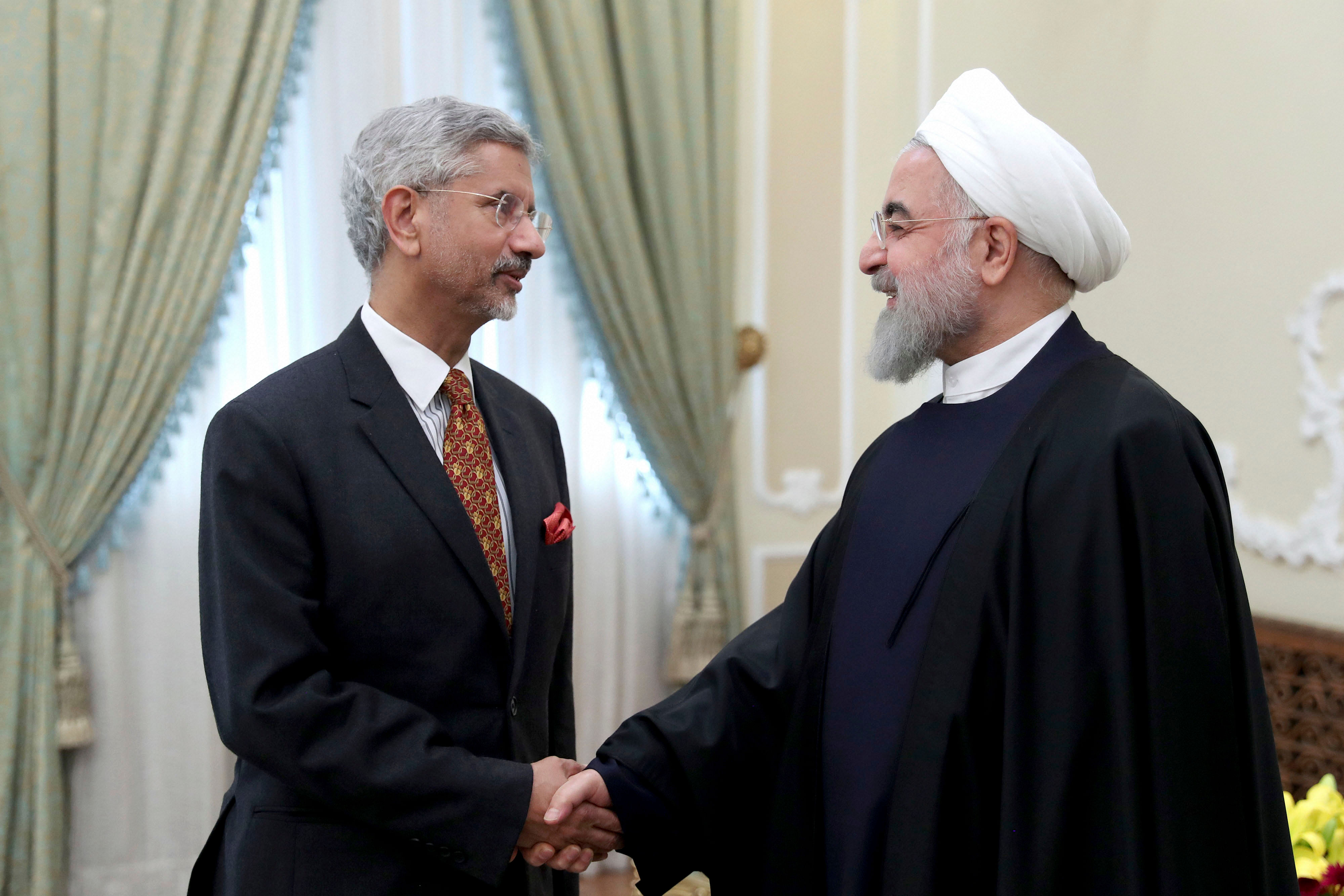 Iranian President Hassan Rouhani, right, welcomes Indian Foreign Minister Subrahmanyam Jaishankar for their meeting in Tehran, Iran. (PTI Photo)