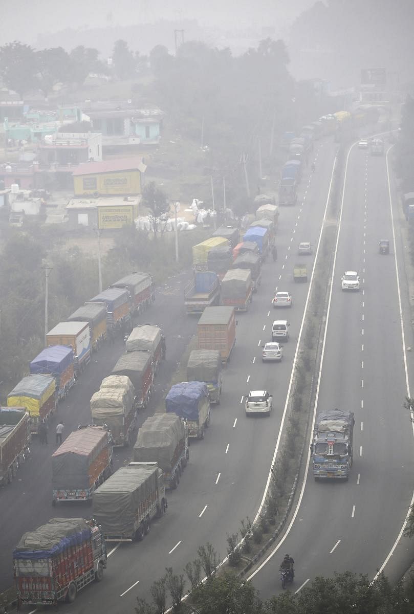 The traffic on the highway is restricted to one-way during the winter months and plies alternatively from Srinagar and Jammu to avoid traffic jam due to ongoing four-laning work. (PTI Photo)