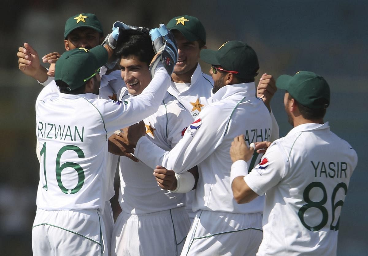 Pakistan players celebrating during the match against Sri Lanka. (AP photo)