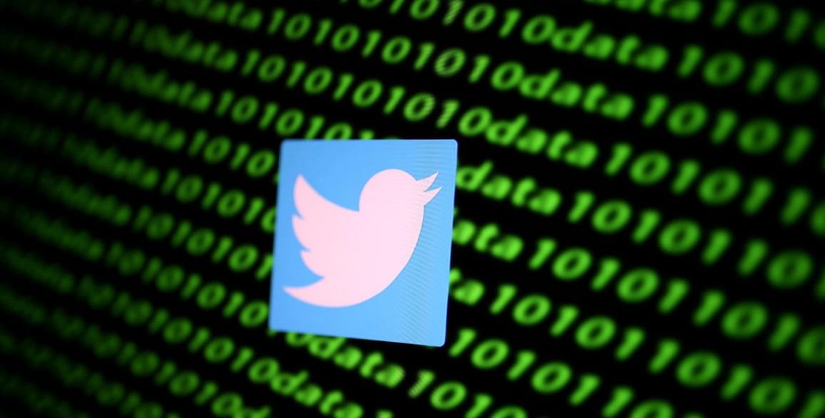The Twitter logo and binary cyber codes are seen in this illustration (Reuters File Photo)