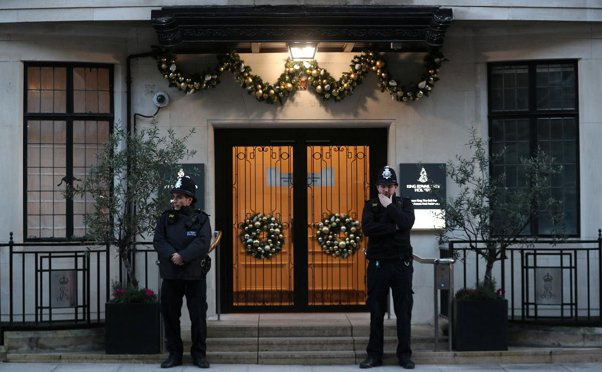 Police officers stand outside King Edward VII's Hospital, where Britain's Prince Philip was admitted, in London. Reuters