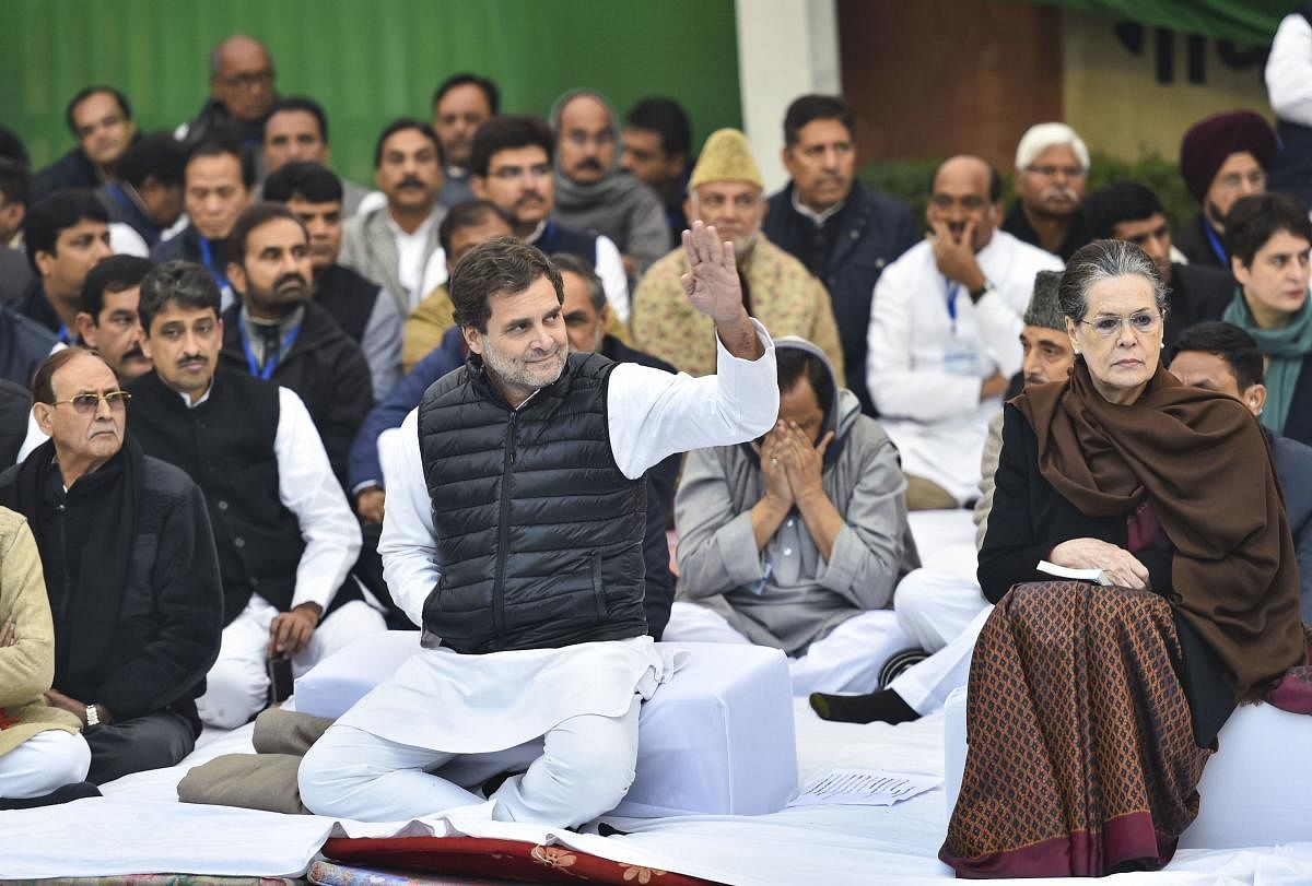 Congress interim president Sonia Gandhi, party leader Rahul Gandhi and other leaders during the 'satyagraha' demanding protection for the Constitution in the view of CAA and NRC, at Mahatma Gandhi's samadhi Rajghat in New Delhi. PTI