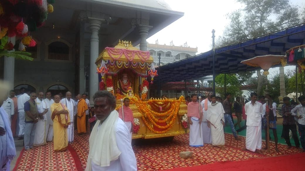 Sri Shivarathreeshwara Swamy's statue was taken out on a procession, accompanied by folk troupes. DH Photo