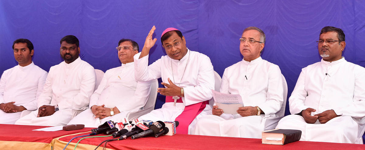 Bishop K A William speaks during a media conference, in Mysuru, on Monday. His assistant Avinash, MDES secretary Vijay Kumar, vicar general for health and education Leslie Moras, vicar general C Rayappa and MDES financial administrator James are seen. dh
