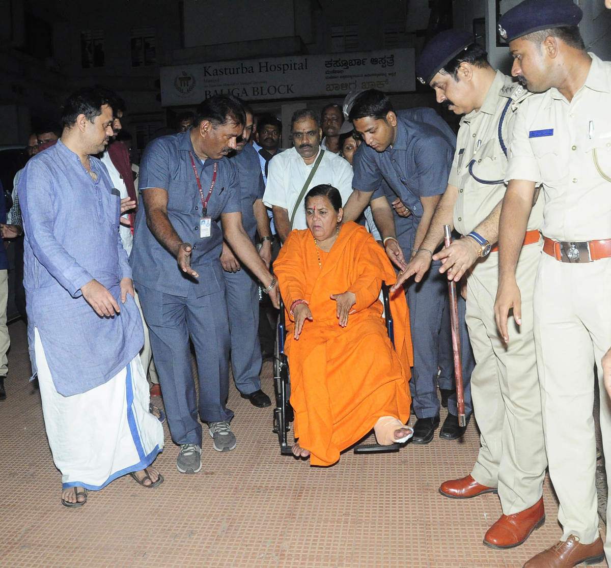 Former union minister Uma Bharti comes out after visiting Pejawar Mutt seer Vishwesha Teertha Swami at KMC in Manipal on Monday.
