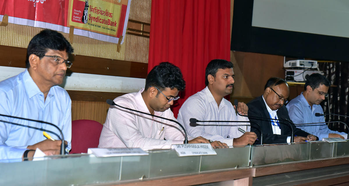Zilla Panchayat CEO Dr R Selvamani speaks at a district consultative committee meeting in Mangaluru.