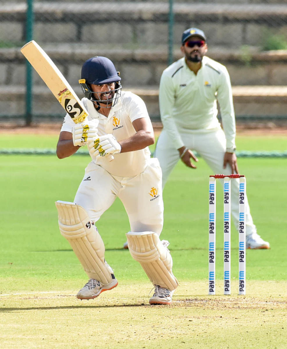 Karnataka captain Karun Nair (left) came up with a timely half century to keep the hosts’ heads above the water against Himachal Pradesh in Mysuru on Wednesday. Haryana pacer Kanwar Abhinay grabbed five wickets. DH Photos/ SAVITHA BR