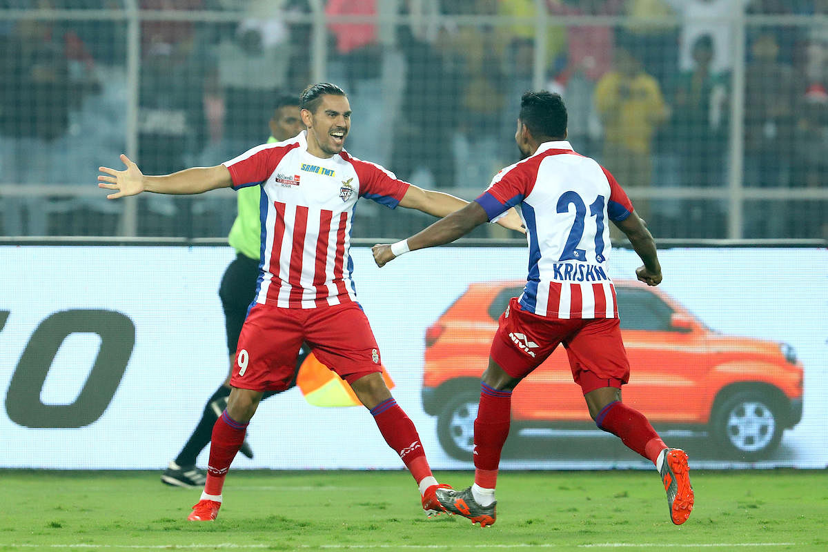 ATK’s David Williams (left) celebrates with Roy Krishna after scoring the winner against Bengaluru FC on Wednesday.