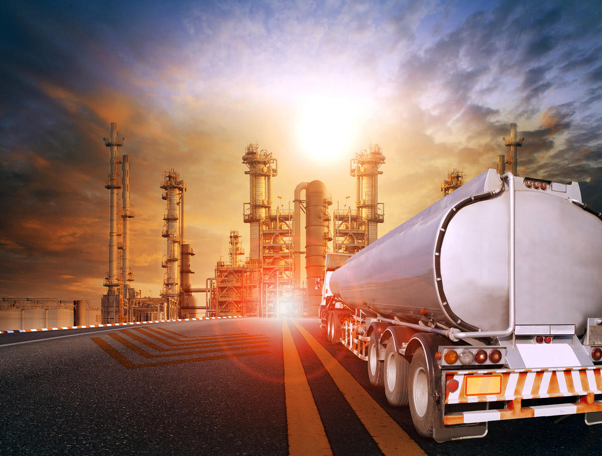 oil container truck and heavy petrochemical industries plant for petroleum fuel industrial theme. (Getty image)