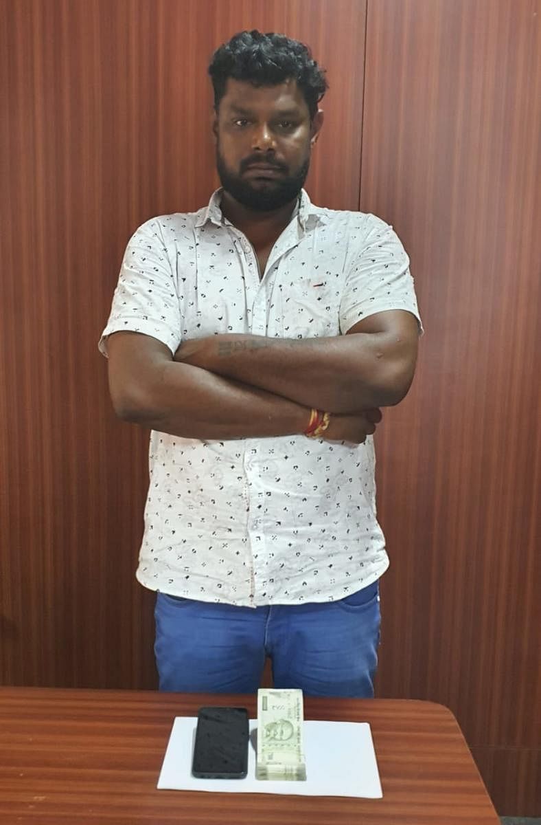 The Central Crime Branch arrested 40-year-old Ravi Mahadev Naik who was running an online betting racket in JP Nagar 1st Phase on Tuesday. PHOTO COURTESY: POLICE