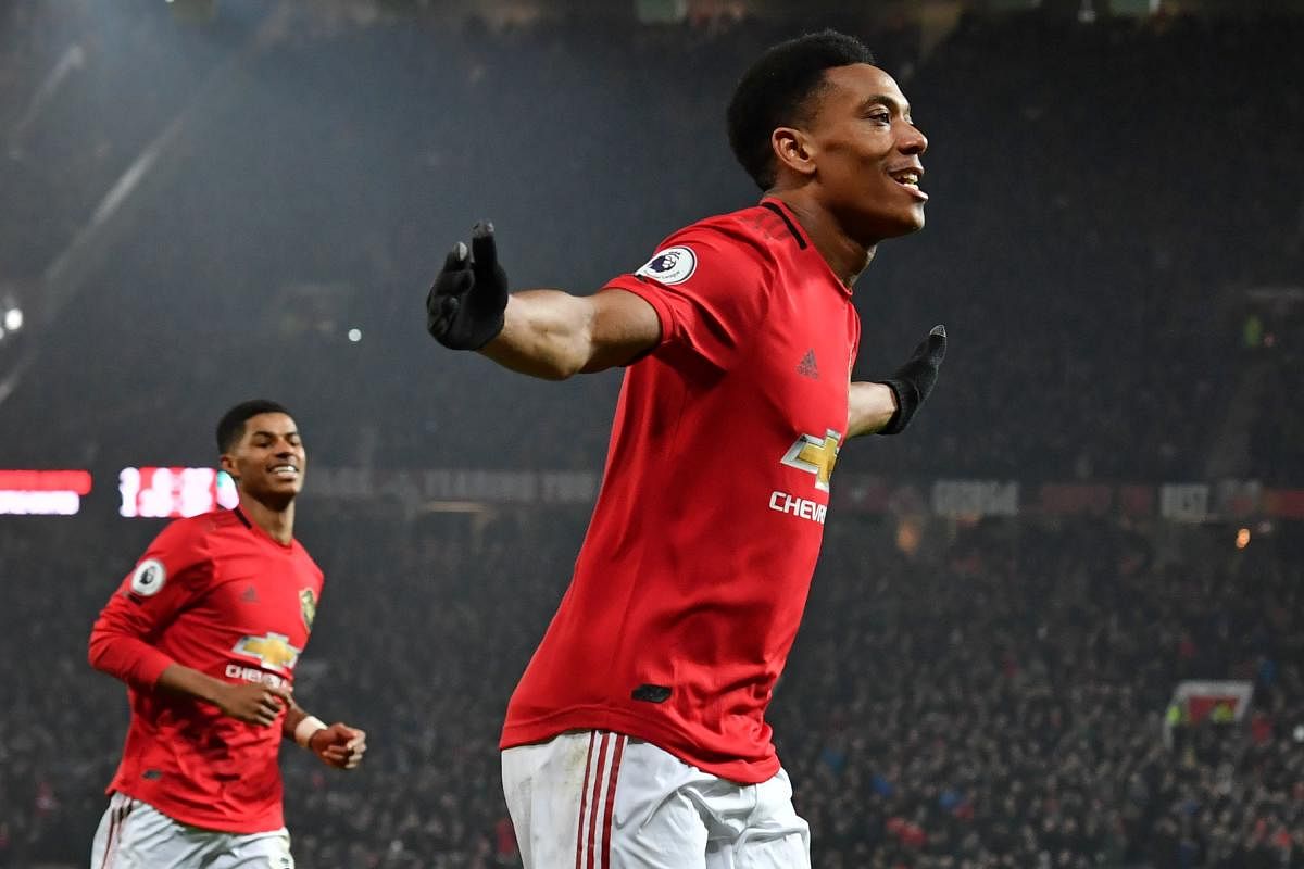 Manchester United's French striker Anthony Martial celebrates after scoring his second goal, the team's fourth during the English Premier League football match between Manchester United and Newcastle United at Old Trafford in Manchester, north west England. (AFP photo)