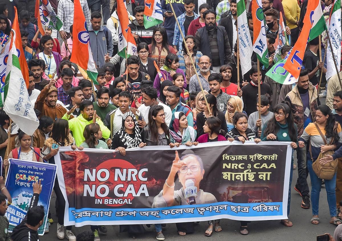 TMC activists during the party supremo and West Bengal Chief Minister Mamata Banerjee's protest rally against the amended Citizenship Act and NRC, in Kolkata. PTI