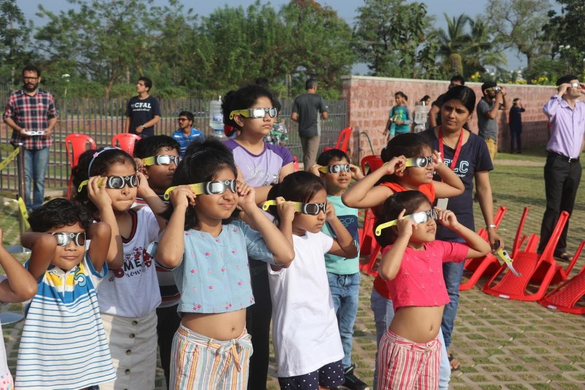 The annular solar eclipse witnessed a lot of people sidelining superstitious beliefs and celebrating the celestial occasion. (DH Photo)