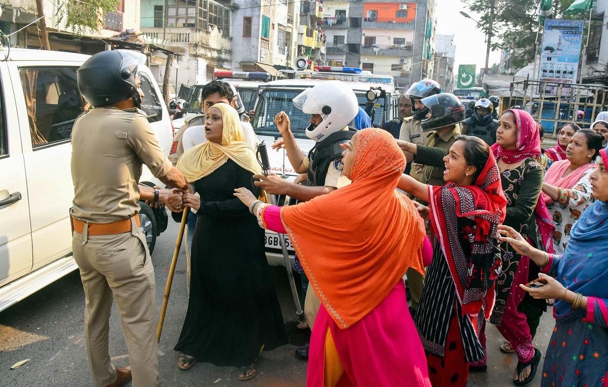 Protestors clash with police personnel during their rally against the amended Citizenship Act and NRC, in Vadodara. PTI