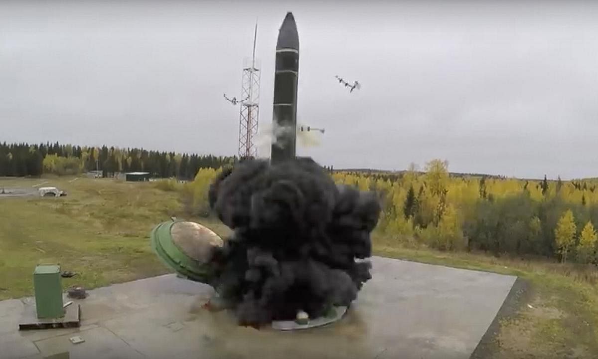 In this photo taken from undated footage distributed by Russian Defense Ministry Press Service, an intercontinental ballistic missile lifts off from a silo somewhere in Russia. (PTI Photo)