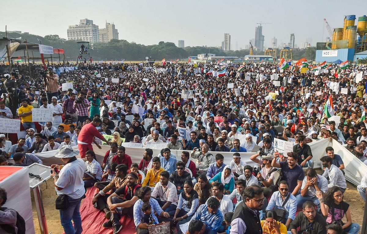 Protesters participate in a rally to oppose CAA and NRC, organised by Joint Action Committee for Social Justice, at Azad Maidan in Mumbai, Friday, Dec. 27, 2019. (PTI Photo)