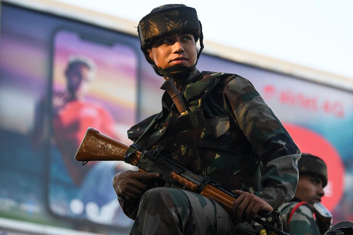 A soldier guards a stree (AFP Photo)