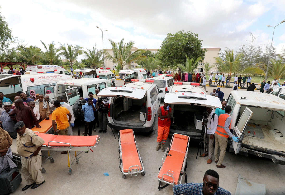 Somali paramedics stand next to their ambulances as a Turkish military cargo plane prepares to evacuate victims of the car bomb explosion at the Afgoye junction, for specialised treatment, at the Aden Abdulle International Airport in Mogadishu, December 29, 2019. (Reuters Photo)
