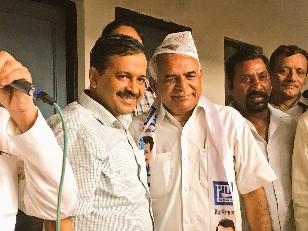 AAP leader Guggan Singh with Arvind Kejriwal (Twitter/@vikaskyogi)