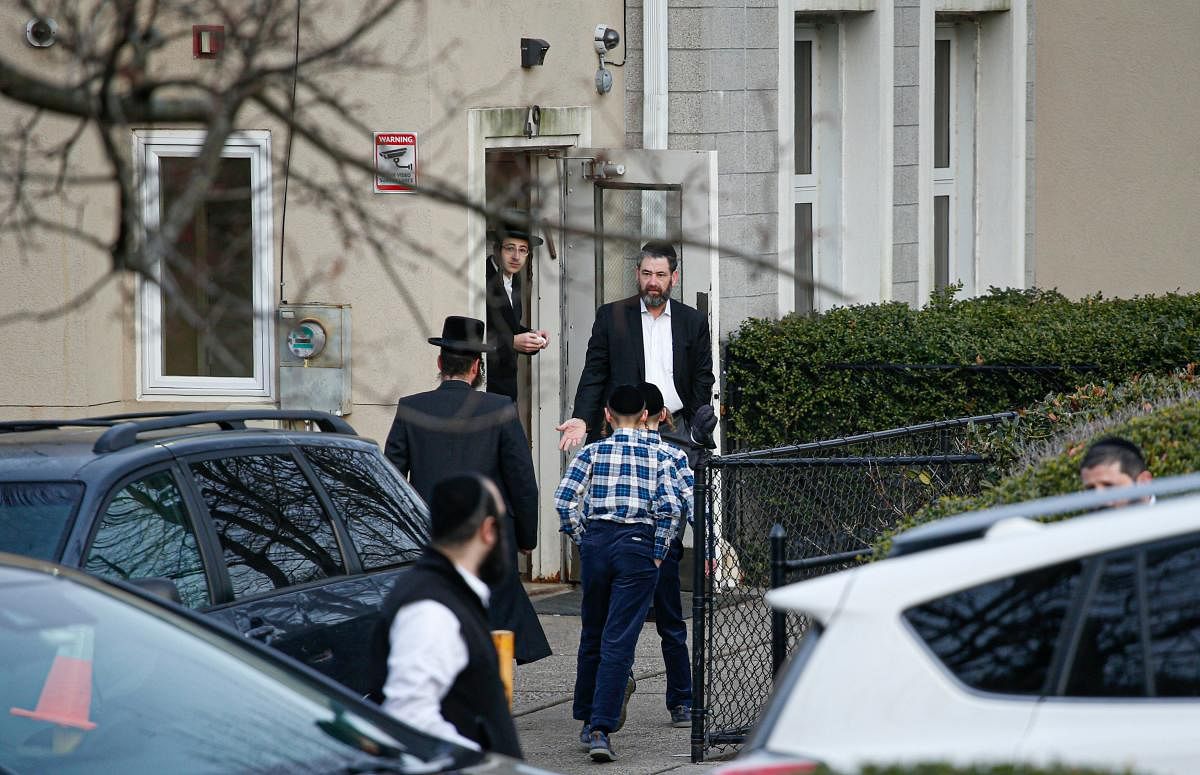 Members of the Jewish community leave from a synagoge next to the home of rabbi, Chaim Rottenbergin Monsey, in New York on December 29, 2019 after a machete attack that took place earlier outside the rabbi's home during the Jewish festival of Hanukkah in Monsey, New York. AFP
