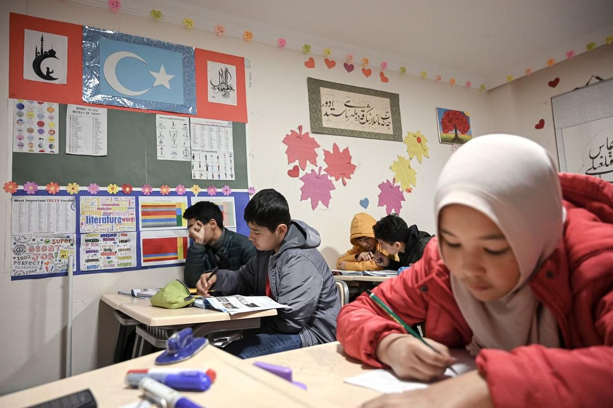 Uighur childen attend a science lesson in a school of Silivri district in Istanbul on November 29, 2019. Out of just over a hundred pupils at the school, 26 have lost one parent to the camps, seven have lost both, says its head Habibullah Kuseni. Photo/AFP