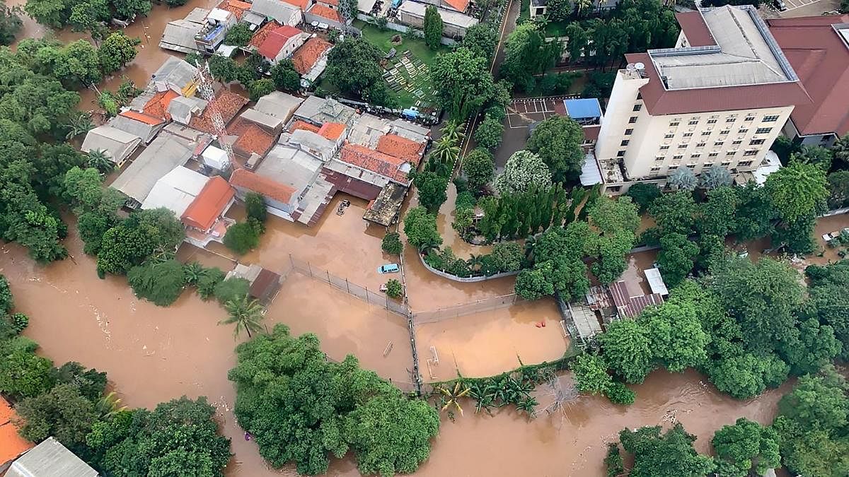 This handout aerial picture taken and released on January 1, 2020 by Indonesia's National Board for Disaster Management (BNPB) shows flooded houses and buildings following overnight rain in Jakarta. (AFP/BNBP Photo)