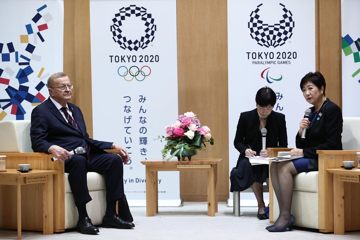 Tokyo Governor Yuriko Koike (R) meets with Chairman of the Tokyo 2020 Olympic Games coordination committee, John Coates in Tokyo on October 25, 2019. - Tokyo's governor said October 25 she opposes moving next year's Olympic marathon and race-walking events to northern Japan over heat fears, describing the proposal as a "bolt from the blue." AFP