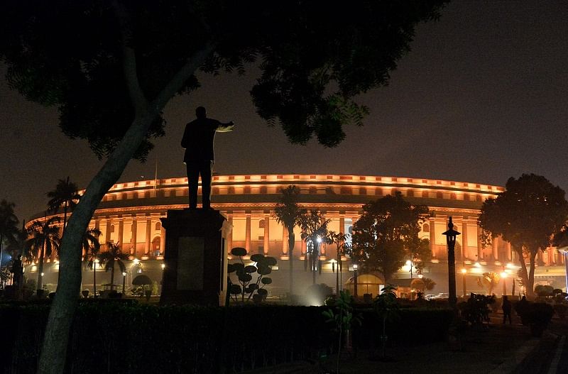 A view of illuminated Parliament House building during the ongoing Winter Session, in New Delhi. (PTI Photo)