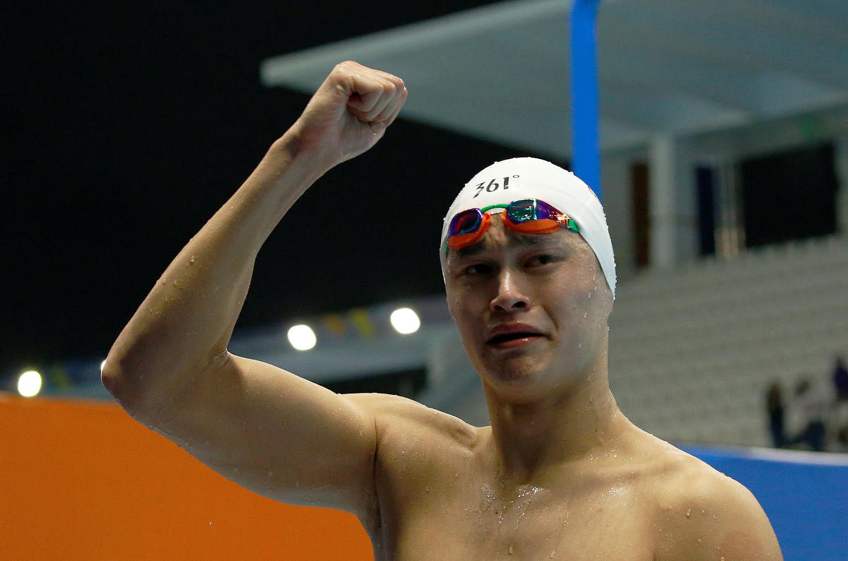 China's Yang Sun celebrates winning the Men's 1500m Freestyle during 2018 Asian Games - Men's 1500m Freestyle Final. REUTERS/Jeremy Lee