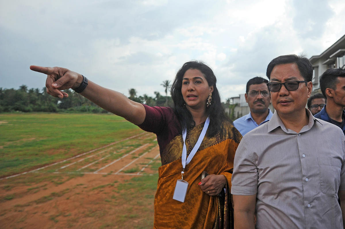 Anju Bobby George (left) shows Sports Minister Kiren Rijiju the facilities at her academy in Bengaluru on Friday. DH PHOTO/ PUSHKAR V
