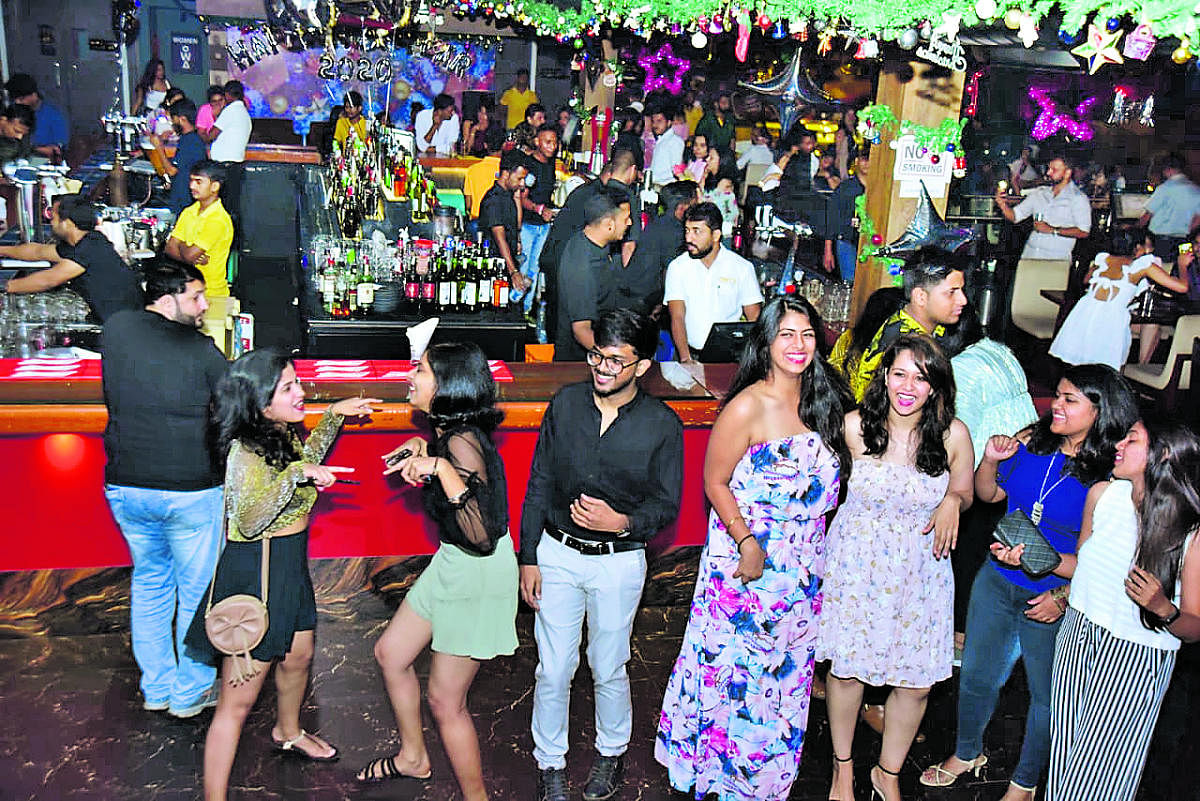 Revellers at a New Year party in Mangaluru on Tuesday evening.