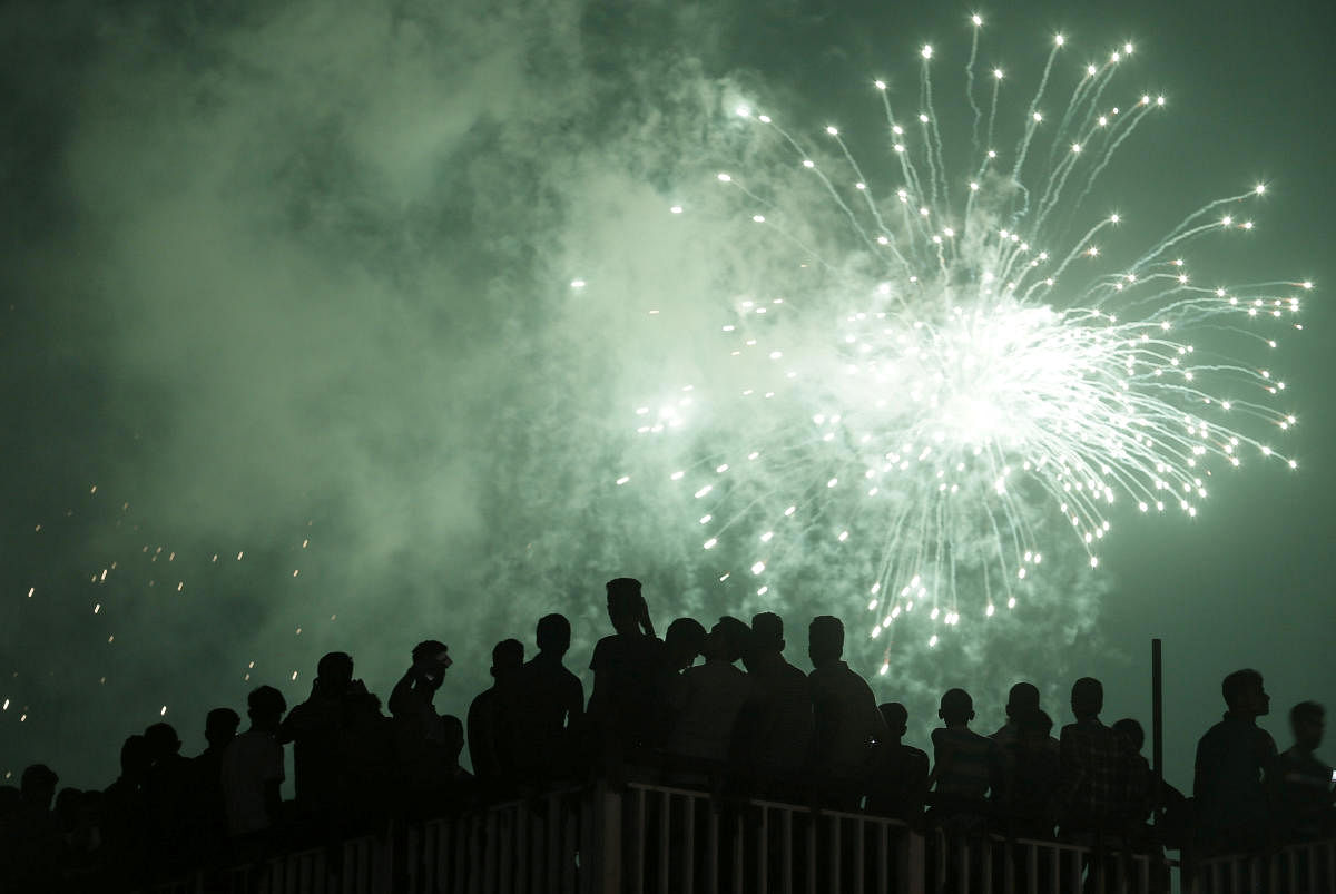 People watch the fireworks during the New Year's celebrations in Colombo. (Reuters Photo)