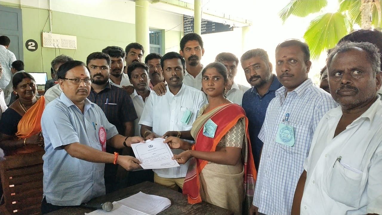 A Ria receiving the certificate of victory from the Returning Officer in Tiruchengode in Namankan district. DH photo