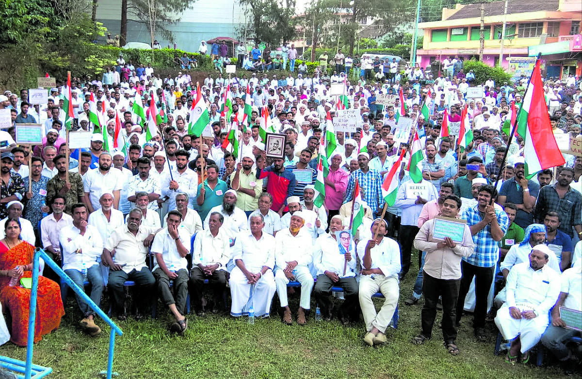 Hundreds of people take part in a protest against the Citizenship (Amendment) Act,at Church grounds in Siddapura on Friday.