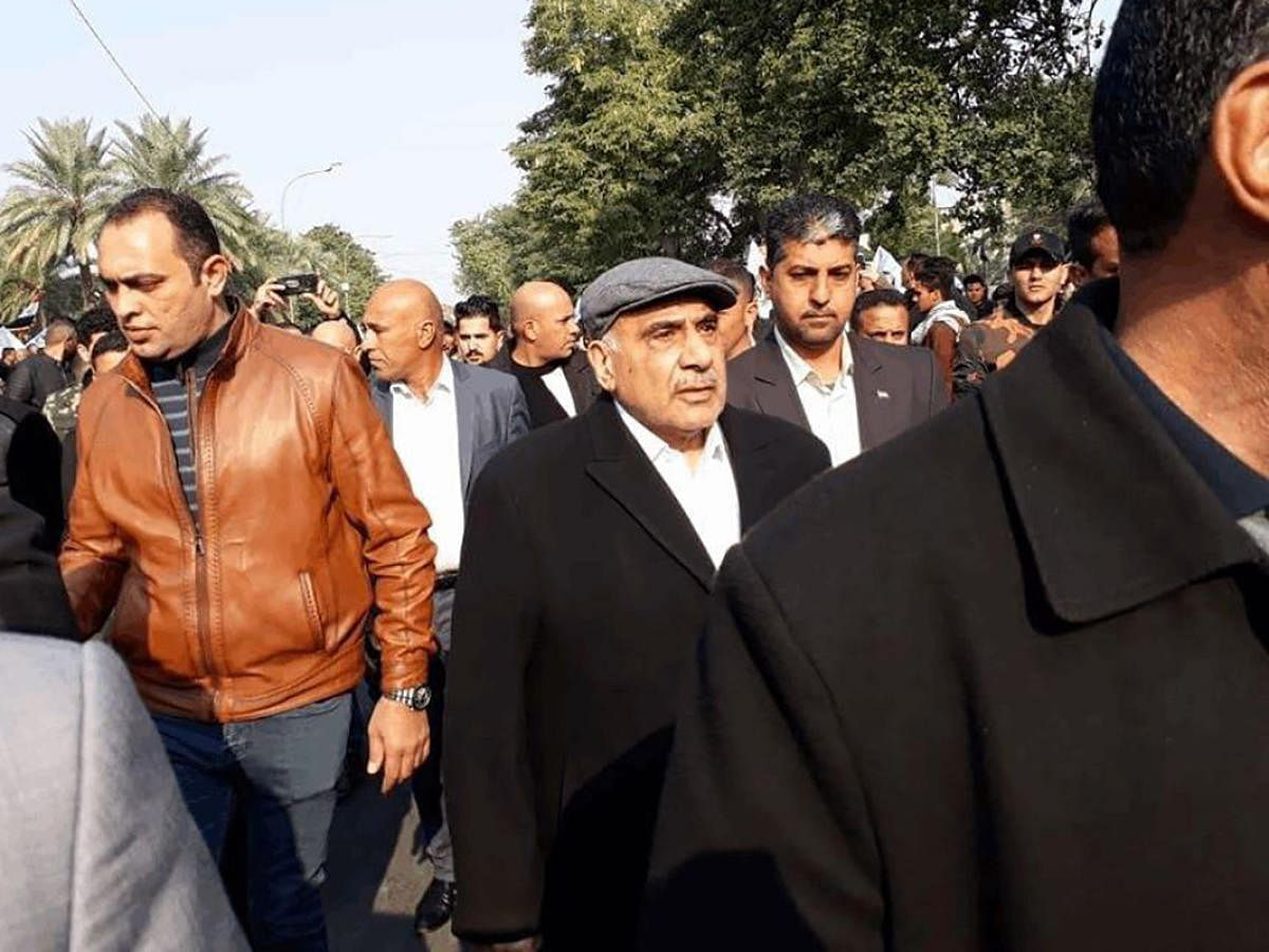 Iraq's caretaker prime minister Adel Abdel Mahdi (C-R) arriving for the funeral of Iranian military commander Qasem Soleimani and Iraqi paramilitary chief Abu Mahdi al-Muhandis in Baghdad's district of al-Jadriya. (AFP photo)