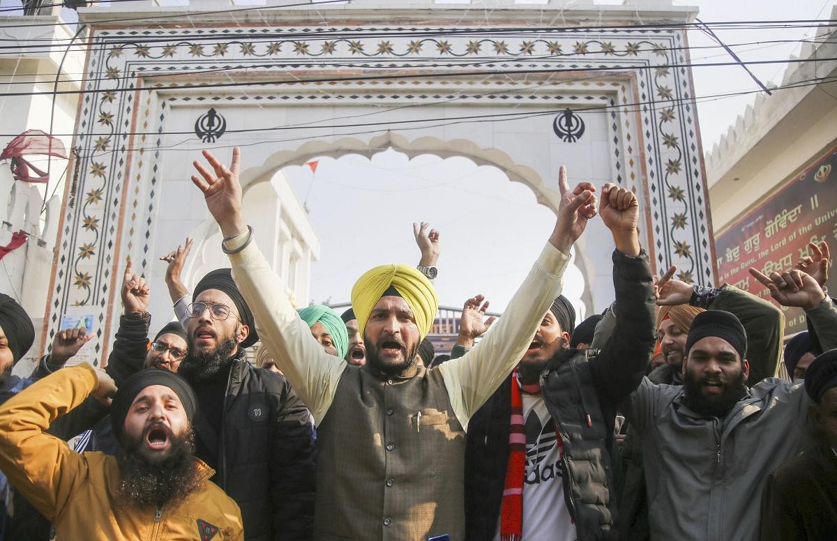 Sikh community people shout slogans during a protest against the aAttack on Pakistan's Nankana Sahib Gurdwara, in Jammu. (PTI photo)