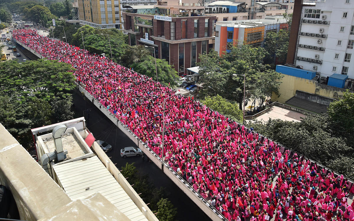 The women in pink gathered at the Freedom Park and protested after several meetings with government officials pertaining to their wages had failed previously. DH Photo