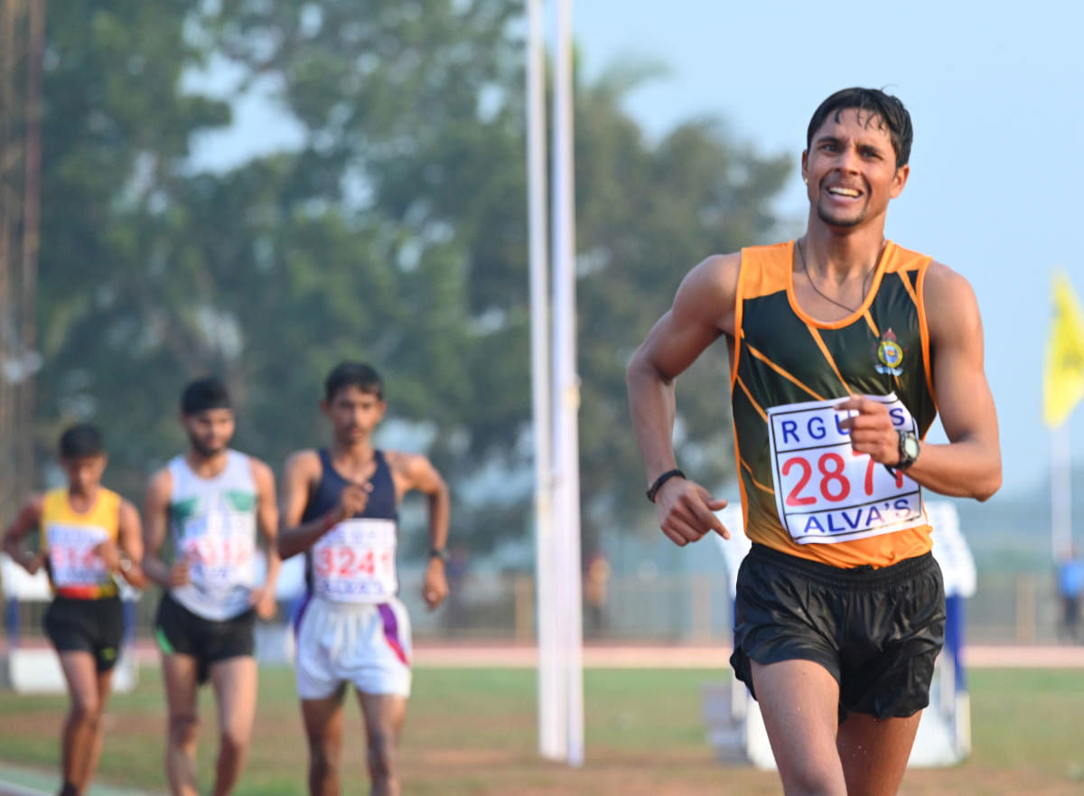 Juned K T of Mangalore University in action during the 20-km race walk for men at the 80th Inter University Athletic Meet in Moodbidri.