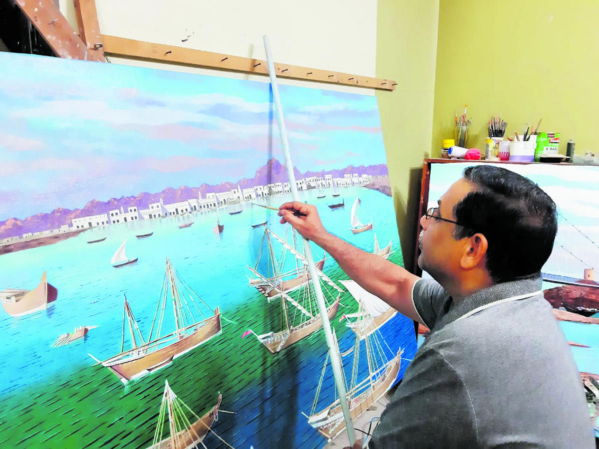 Mohamad Nazir gives the final touches to an artwork.