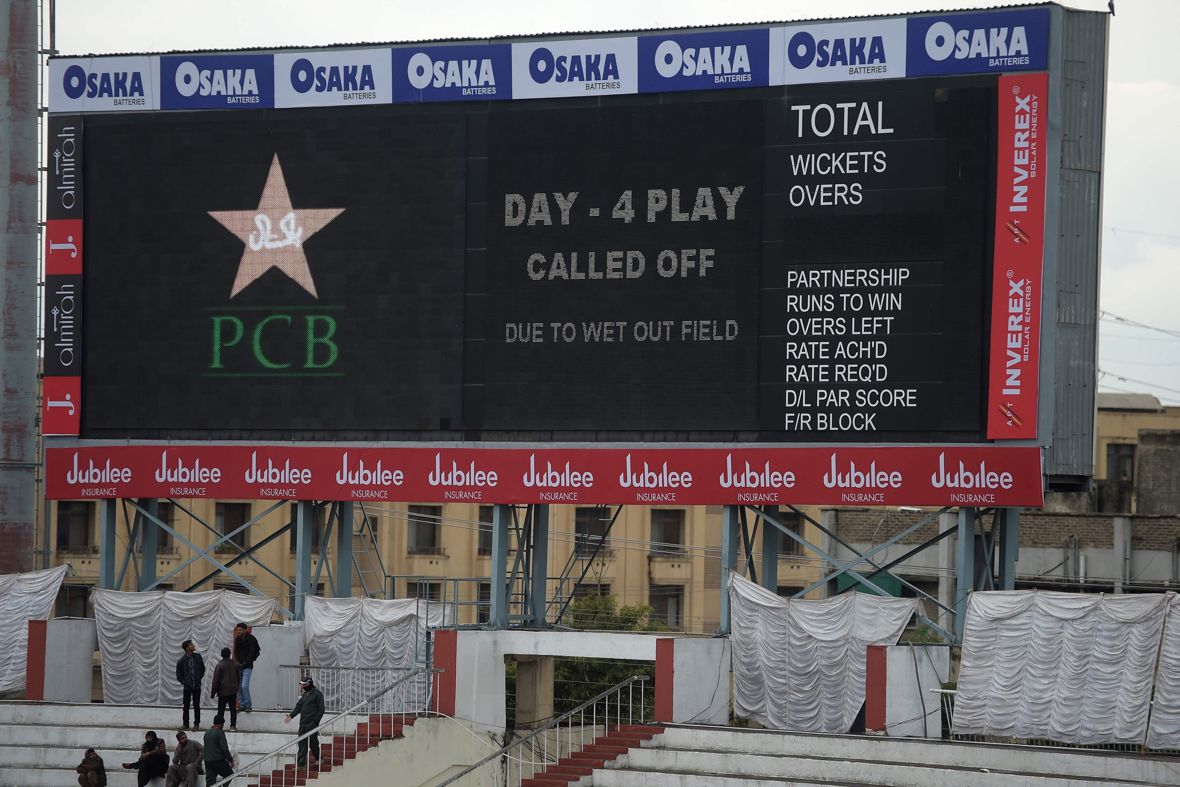 A score board announces that play was called off following overnight rain on the fourth day of the first Test cricket match between Pakistan and Sri Lanka at the Rawalpindi Cricket Stadium in Rawalpindi. (AFP Photo)