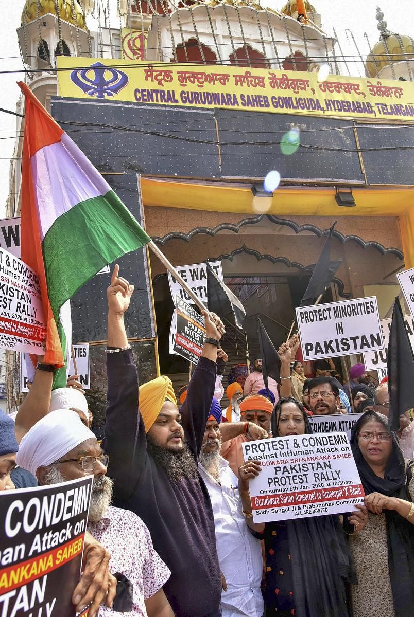 Members of the Sikh community hold placards as they raise slogans condemning vandalism at Nankana Sahib Gurudwara in Pakistan, at Central Gurudwara Saheb Gowliguda in Hyderabad, Sunday, Jan. 5, 2020. (PTI Photo)
